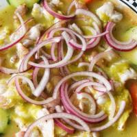 Aguachiles · Whole shrimp marinated in fresh lime juice with your choice of green, red, or black sauce.