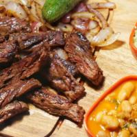 Carne Asada · 10oz Grilled skirt steak seasoned with our house seasoning(Comes with a side of frijoles cha...