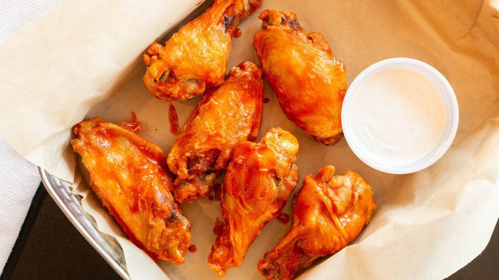 Mr Brews Wings · Fresh chicken wings, fried and tossed in your favorite sauce, BBQ, honey garlic, buffalo, spicy Asian, extra hot buffalo. Served with your choice of homemade ranch or bleu cheese dressing.