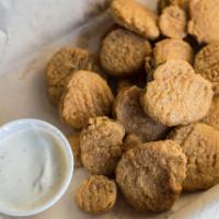 Fried Pickle Chips · A healthy portion of breaded dill pickle slices, crispy fried and served with a side of home...