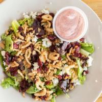 Cranberry Walnut Salad · A fresh mix of salad greens, walnuts and dried cranberries topped with bleu cheese crumbles ...