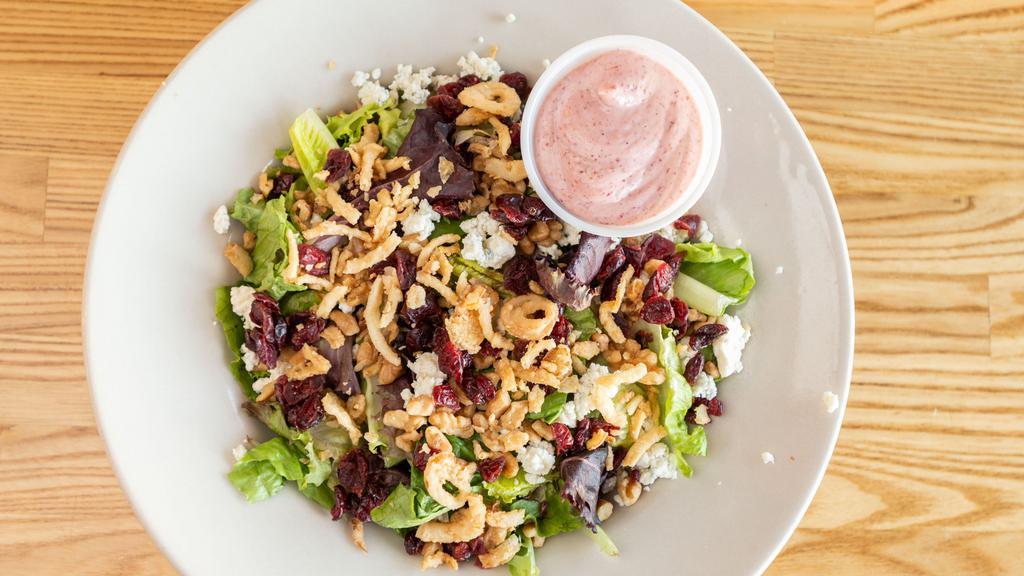 Cranberry Walnut Salad · A fresh mix of salad greens, walnuts and dried cranberries topped with bleu cheese crumbles and crispy French fried onions. Served with your choice of dressing.