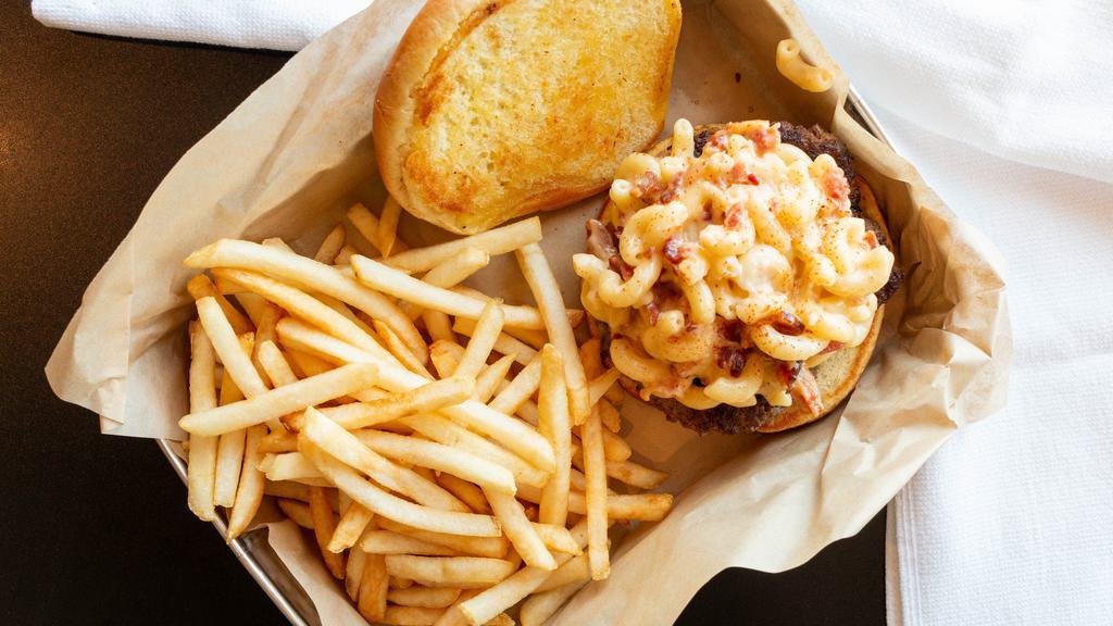 Bacon Mac N Cheese Burger · Our signature all beef patty topped with your childhood favorite, mac n' cheese. Finished off with chopped bacon and a dash of cayenne pepper.