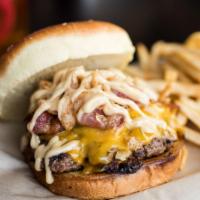 Kentucky Bourbon Burger · This tantalizing crowd pleaser adds cheddar cheese crowned with grilled onions, bacon, Frenc...