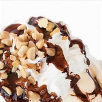 Brownie Sundae · Delicious fudge brownie with french vanilla ice cream,  chocolate drizzle, pecan nuts, toppe...