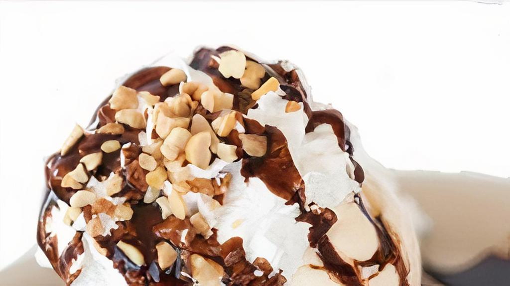 Brownie Sundae · Delicious fudge brownie with french vanilla ice cream,  chocolate drizzle, pecan nuts, topped with whip cream