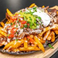 Queso Fajita Fries · Large bed of fries loaded with grilled steak, cheese, pico de gallo, guacamole, sour cream, ...