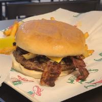 Western Burger · Large homemade burger patty grilled to perfection served with Monterey jack cheese, crispy b...