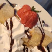 Cheesecake Chimi · El Paso Fave! Cheesecake-filled chimichanga deep-fried, rolled in sugar and cinnamon, and se...