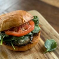 Portabello Burger (Vegetarian) · Portabella mushroom cap marinated, topped with blue cheese and pecans.  Served with tomato, ...