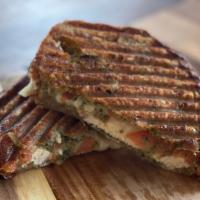 Chicken Pesto · Housemade Pesto, chicken, provolone and tomatoes grilled on wheat bread.