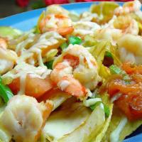 Shrimp Fajitas Nachos · Corn tortilla chips with shrimp, green peppers, onions, and tomatoes.