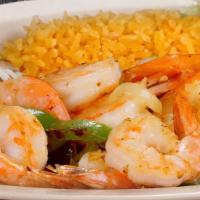 Shrimp Fajitas · Tender shrimp with bell peppers, green onions, guacamole, rice and refried beans with cheese...