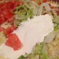 Enchiladas Supreme · Supreme combinations consisting of one chicken, one bean, one cheese and one beef topped wit...