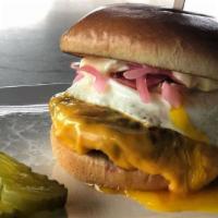 Rise & Shine Burger · Over easy egg, smokehouse bacon, pickled onions and American cheese