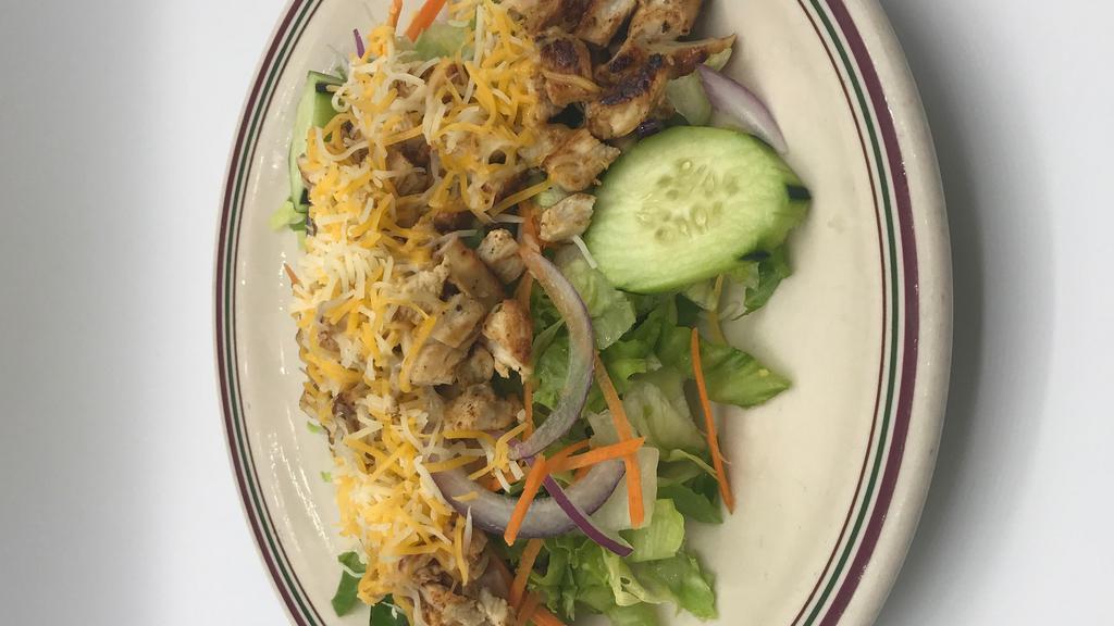 Grilled Chicken Salad · Tender juicy pieces of grilled chicken chopped and served atop a fresh bed of chopped lettuce, red onions, carrots, tomatoes, cucumbers, and shredded cheese.