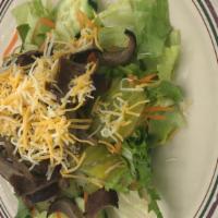 Gyro Salad · Fresh bed of lettuce topped with gyro meat, tomatoes, cucumbers, red onion, pickles, carrots...