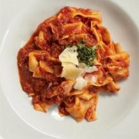 Pappardelle Bolognese · Fresh house-made pappardelle pasta traditional italian bolognese sauce parmesan basil.