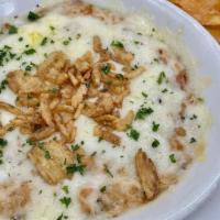 Salmon Dip · Cream Cheese, Charred Onions, Herbs, Provolone,  Swiss, Topped with French Fried Onions serv...