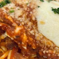 Parmesan Chicken · Chicken Breast Deep Fried and Topped with Marinara Sauce and Mozzarella Cheese. Served on Li...