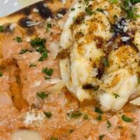 Lobster Manicotti · Crab, Ricotta Cheese, and Herb Filled Pasta, Lobster tail, Rose Sauce