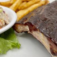 Bbq Ribs · 1/2 Rack House Made Smoked Baby back Ribs, Smothered in John Tom's BBQ Sauce