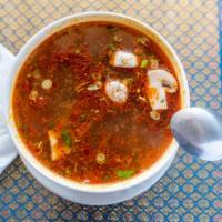 Tom Yum Gai · Clear hot and sour soup with chicken, mushrooms, tomato, green and white onion, cilantro, li...