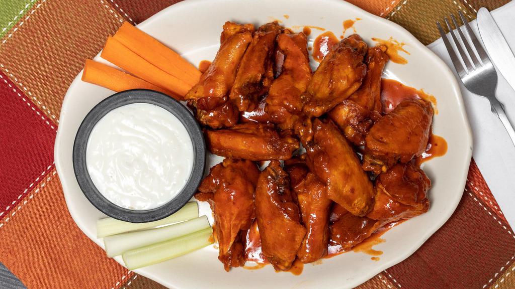 Buffalo Chicken Wings · Served with blue cheese, celery, and carrot sticks.