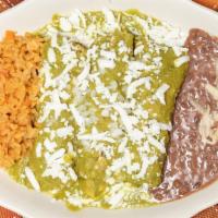 Enchiladas · 3 corn tortillas rolled and covered with red or green sauce served with rice and beans.