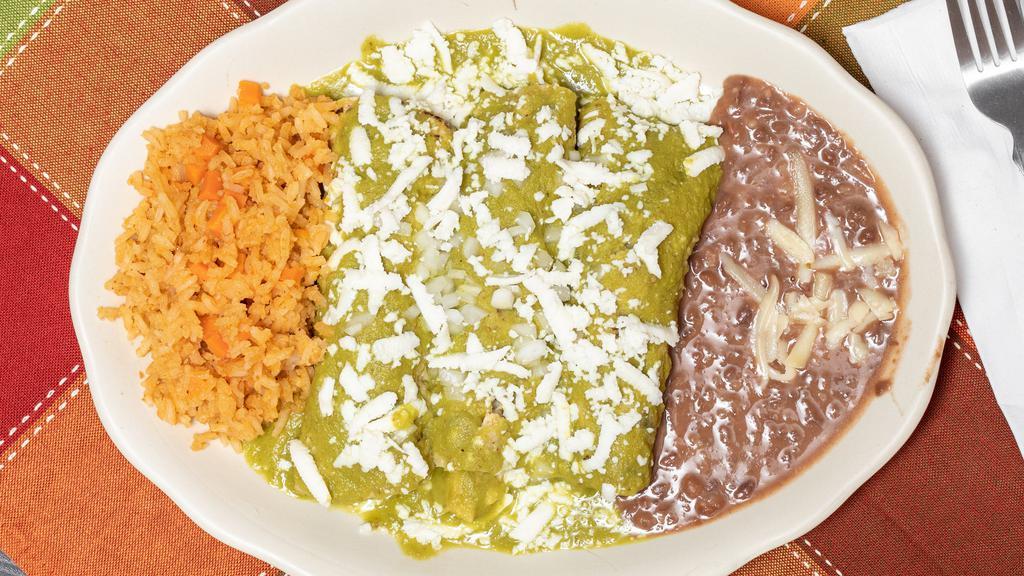 Enchiladas · 3 corn tortillas rolled and covered with red or green sauce served with rice and beans.
