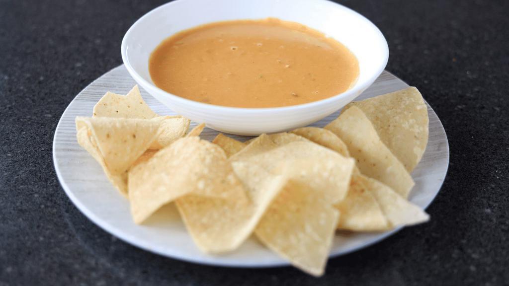 Chile Con Queso Small · Savory melted cheese, spiced with chile peppers and Tumbleweed seasonings. Served with corn tortilla chips.