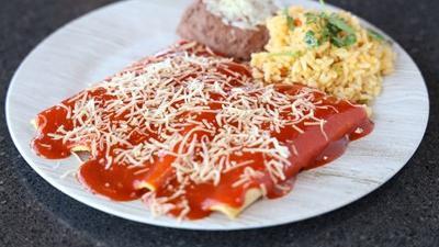 Three Enchilada Dinner · Served enchilada-style, with one beef, one chicken and one cheese enchilada.