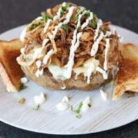 Lunch Tex Mex Chicken Potato · Baked potato loaded with mesquite grilled chicken and cheese, topped with onion straws, cila...