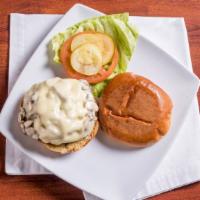 Baby Swiss Angus Mushroom Burger · Half pound Angus burger served with lettuce, tomatoes, pickle, and onions on a signature bun.