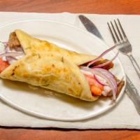 Gyro Wrap · Sliced gyro meat, grilled onions, tomatoes, and tzatziki sauce.