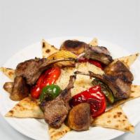 Lamb Chop Kebab · Grilled green peppers, red peppers, mushrooms, onion, 4 pieces of Lamb Chops, served with ri...