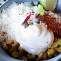 Esquite  · Esquite off the cob covered in butter, cotija cheese, limw juice,