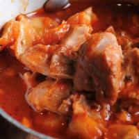 Pozole · Traditional Mexican broathy soup made with pork, hominy and chiles