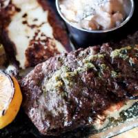 Carne Asada · Marinated open-fire grilled skirt steak
panela | rice | beans | onions | cactus