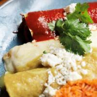 Enchiladas Mexicanas · Corn tortillas filled with beef , chicken , cheese. Served with rice and veggies
