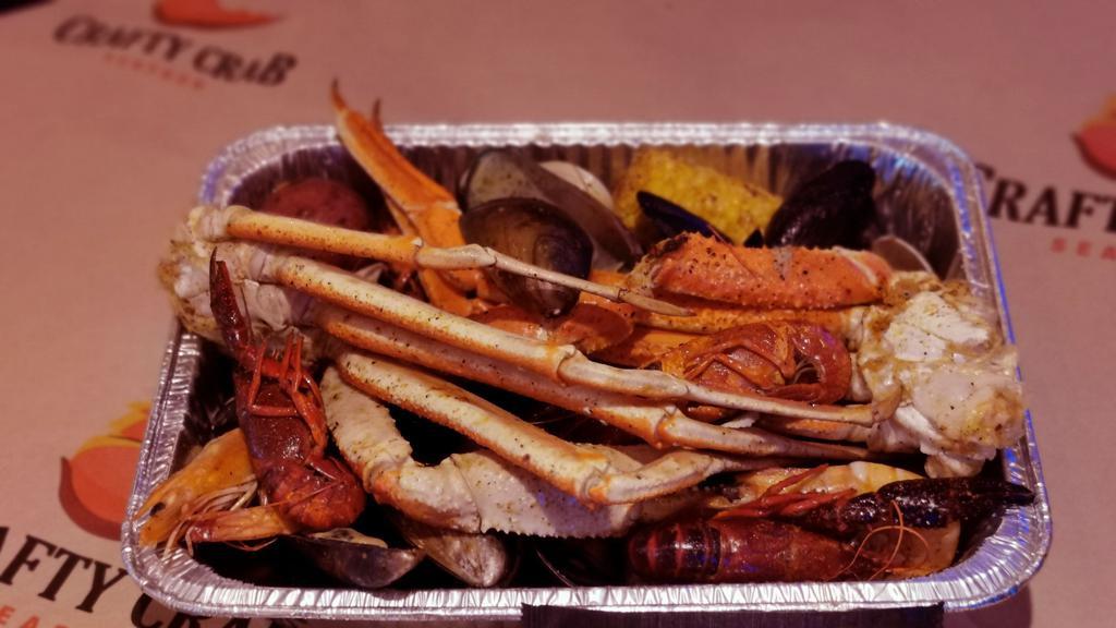 Large Platter · 1.5 pound(three cluster)Snow crab leg, 3/4 pound Whole shrimp, 3/4 pound Crawfish, 3/4 pound Mussels, 3/4 pound Clams  5 potatoes and 3 corn on the cob.