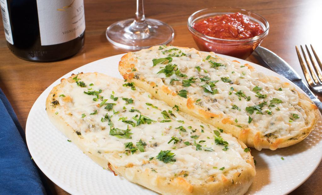 Cheese Bread · Toasted with oil, garlic powder, mozzarella, and provolone; served with a side of Marinara
