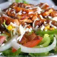 Chicken Caesar Salad · Crisp romaine lettuce, grilled chicken, parmesan cheese and croutons tossed in Caesar dressi...
