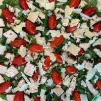 Chicken Pesto · Pistachio pesto, chicken, spinach, shaved Parmesan, cherry tomatoes, and shredded mozzarella.