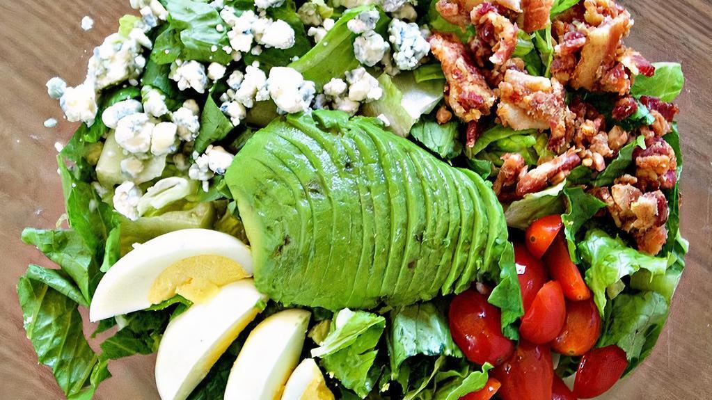 Cobb · Romaine, bacon, cherry tomatoes, blue cheese, hard boiled eggs, and avocado.