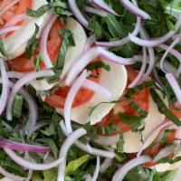 Caprese Salad (Large) · Romaine, arugula, fresh mozzarella, roma tomatoes, red onion, and basil with a balsamic vina...