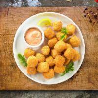 Tots To Ponder · (Vegetarian) Shredded Idaho potatoes formed into tots, battered, and fried until golden brown.