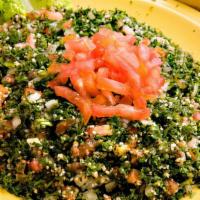 Tabbouli Salad · A mixture of chopped parsley, tomato, onion, cracked wheat, tossed with our olive oil blend ...