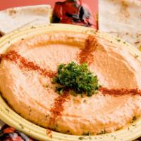 Red Pepper Hommus · Hommus with a red pepper kick. Served with fresh bread.