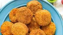 Fried Green Tomatoes · Southern style corn meal battered fried green tomatoes are deep fried, and served with our h...